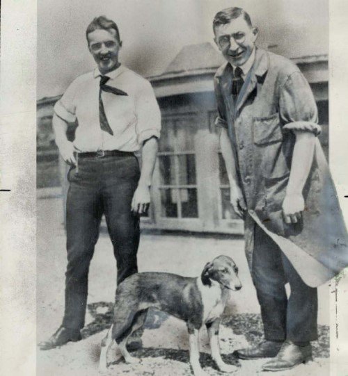 Frederick Banting and Charles Best standing with the first dog treated with insulin in 1921.