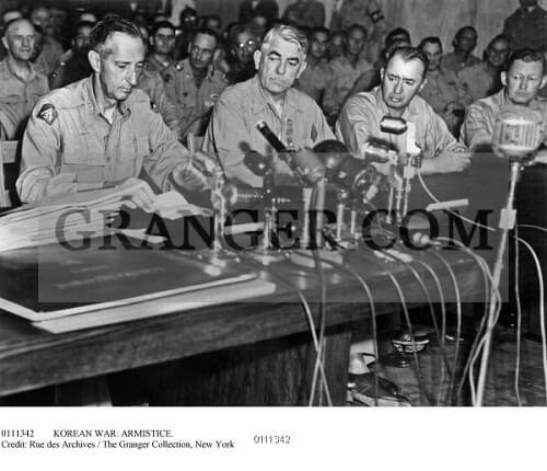 General Mark Clark signing the Korean War Armistice in Panmunjom, Korea, July 27, 195
